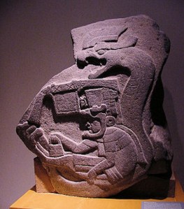 Olmec stone carving of snake and human figure, Villahermosa, Mexico